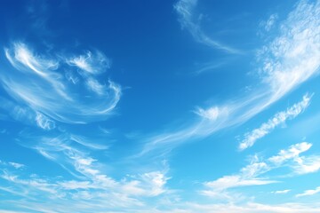 Bright Blue Sky with Wispy Clouds: A Serene Daytime View