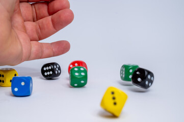 Man's hand throwing dice isolated on white background