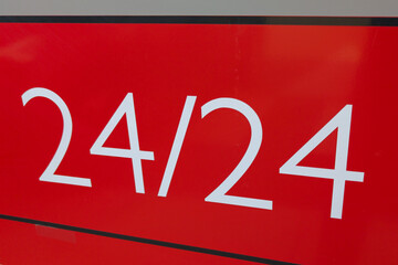 24/24 24 hours Service text sign over red Background