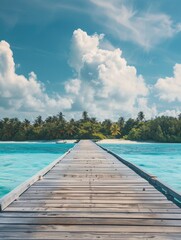 Obraz premium A wooden bridge spans a body of water, with a clear blue sky above. The scene is peaceful and serene, with palm trees in the background