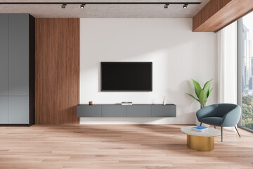 Modern home living room interior with armchair and tv screen, panoramic window