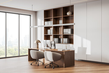 Stylish business interior with ceo desk near panoramic window, pc and shelf