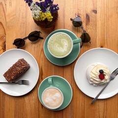 A delightful flat lay of pastries and coffee, showcasing a tempting assortment of sweet treats and a steaming cup, perfect for a cozy moment