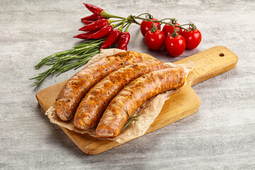 Raw sausages with spices and herbs