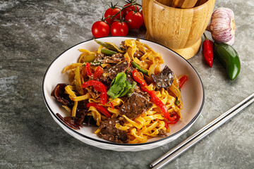 Asian wok with noodle, vegetables and beef