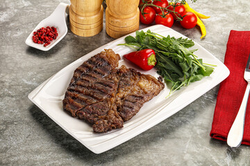 Grilled chuck roll steak with arugula