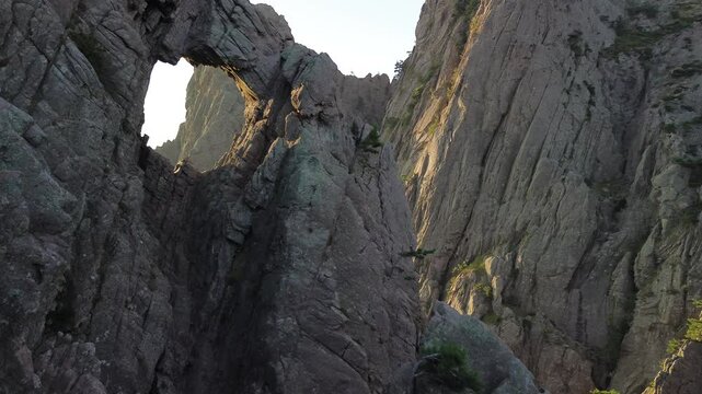 Trou de la Bombe, Massiv dde Bavella, Corse, France at sunrise, view from drone