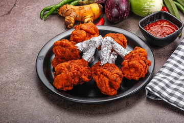 Indian cuisine glazed chicken lollipop