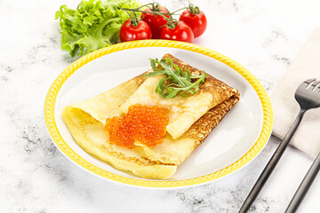 Russian pancake with red caviar