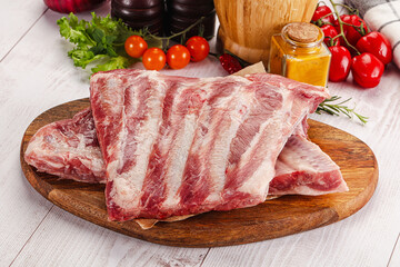 Raw pork ribs over board