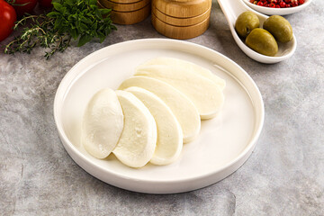 Organic mozzarella cheese slices in the plate