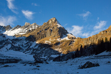 Sun shining on mountain during the early morning