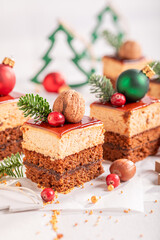 Homemade Christmas cake decorated with nuts and spruce for Christmas..