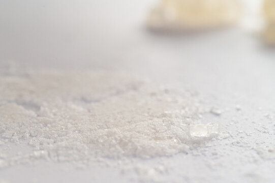 World Drug Day. World AIDS Day. Conceptual image of bath salts synthetic cathinones drugs narcotics concept. White crystal powder, crystals and lines on white background