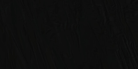 Dark black crumpled paper texture background. black crumpled and top view textures can be used for background of text or any contents.	