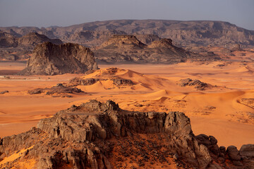 Naklejka premium The Tadrart Rouge means Red Mountain. It is a mountain range in southeastern Algeria. The area has a rich array of rock art.