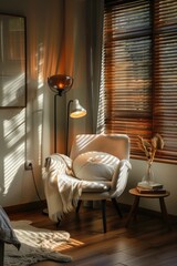 A chair with a white pillow and a blanket draped over it sits in front of a window. The room is well lit and has a cozy, comfortable atmosphere