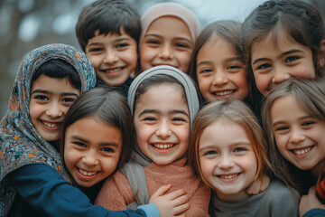 Obraz premium A group of children are smiling and hugging each other