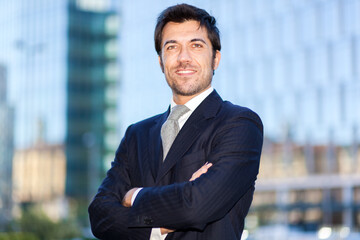 Confident businessman outside office building