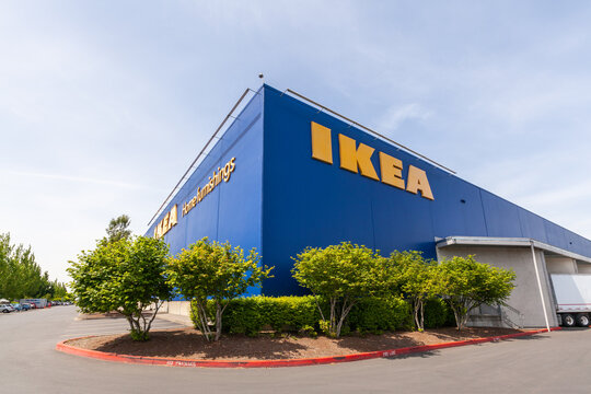 Portland, Oregon, USA-May 12, 2019: Ikea famous Swedish furniture store warehouse with its big yellow logo sign, near PDX airport in Portland. High quality picture for download