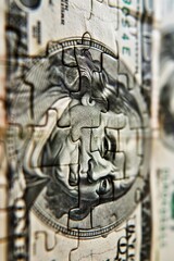 Obraz premium Macro view of a fragmented puzzle with a dollar bill design, highlighting the face and texture details.