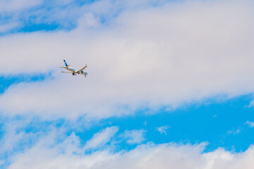 Passenger airplane flying in the blue sky