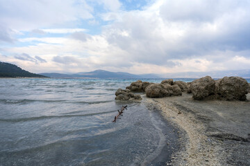 Serene Landscape of Lake Salda with Rocky Shoreline in Turkey