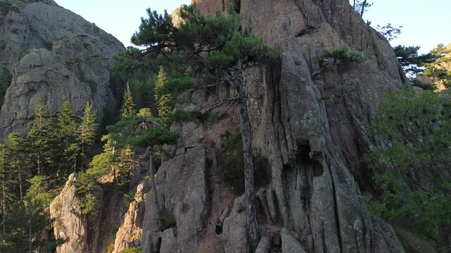 Trou de la Bombe, Massiv dde Bavella, Corse, France at sunrise, view from drone