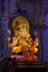 Fototapeta premium 07 September 2024, Pune, Maharashtra, India, Beautiful sculpture of Lord Ganesh called as Tambdi Jogeshwari Ganpati near ABC chowk, Pune, during Ganesh Utsav Festival 2024.