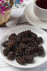 Candied pine cones on a light background