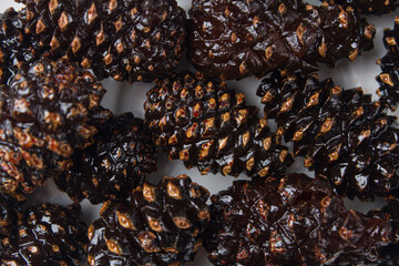 Candied pine cones on a light background
