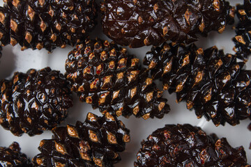Candied pine cones on a light background
