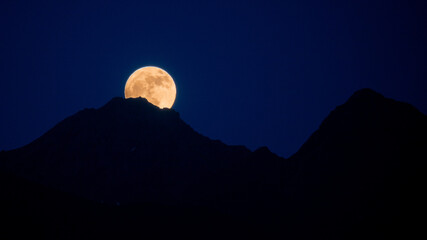 Full moon over mountain range © RP007
