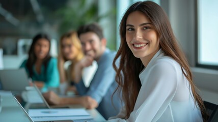 Fototapeta premium Confident businesswoman leading a productive team meeting in office