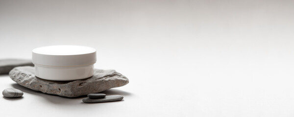 Minimalist Skincare Cream Jar on Natural Stone with Soft Neutral Background