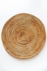 A round wooden plate with a brown color. The plate is made of straw and has a rustic look