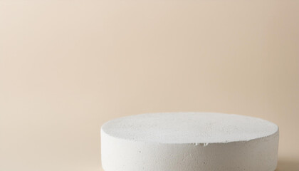 Empty round podium for product presentation, minimal pedestal. Light beige backdrop.