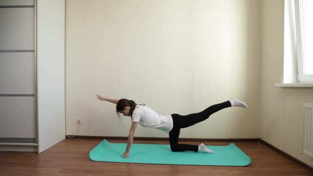 Teenage girl doing yoga at home, engaged in morning stretching and fitness routines, maintaining a zen state and promoting overall well-being