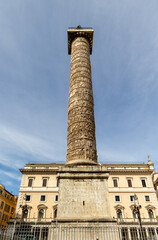 Fototapeta premium Rome, Italy - April 09, 2024: Egyptian obelisk in Colonna square in Rome with tourists crowding its surroundings in Rome, Italy