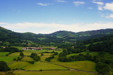 Fototapeta premium Amaiur (Maya). Typical landscapes of the Baztán Valley. Amaiur is a Pyrenean town with an incredible natural environment, surrounded by green meadows at the end of summer and gentle hills.