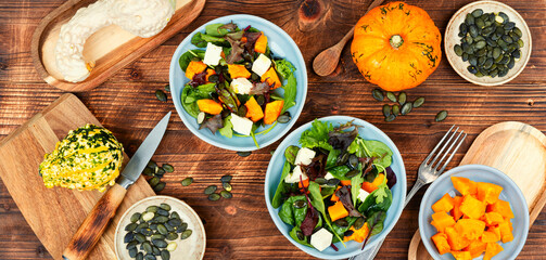 Pumpkin salad with pumpkin seeds.