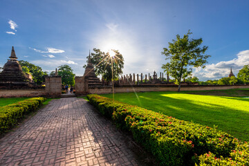 Fototapeta premium Background atmosphere inside the important historical tourist attraction Sukhothai Historical Park,foreign tourists from all over the world like to bring their children study history during holiday.