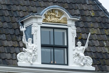 Dormer window decorated with figures