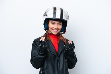 Young Russian girl with a motorcycle helmet isolated on white background making money gesture