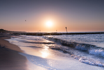 Serene sunset at the shoreline in Kolobrzeg, Kołobrzeg