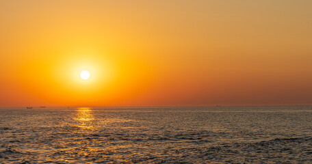 Serene sunset at the shoreline in Kolobrzeg, Kołobrzeg