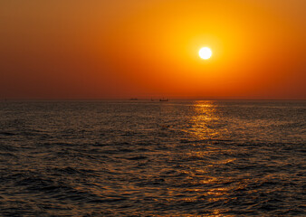 Serene sunset at the shoreline in Kolobrzeg, Kołobrzeg