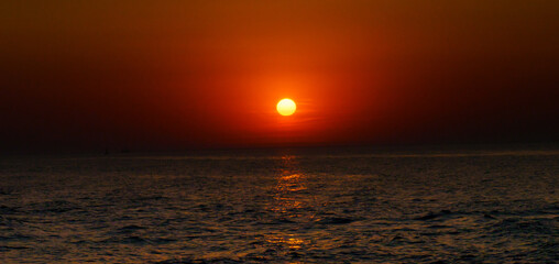 Serene sunset at the shoreline in Kolobrzeg, Kołobrzeg