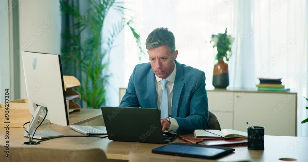 Poster office, typing and mature man at laptop with research, review or web analysis for business plan at d