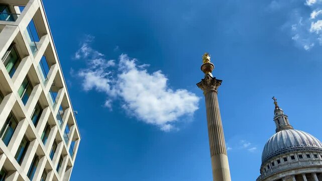 Pan from London Stock Exchange across Paternoster Square to the historic dome of St. Paul&rsquo;s Cathedral in the heart of London.
